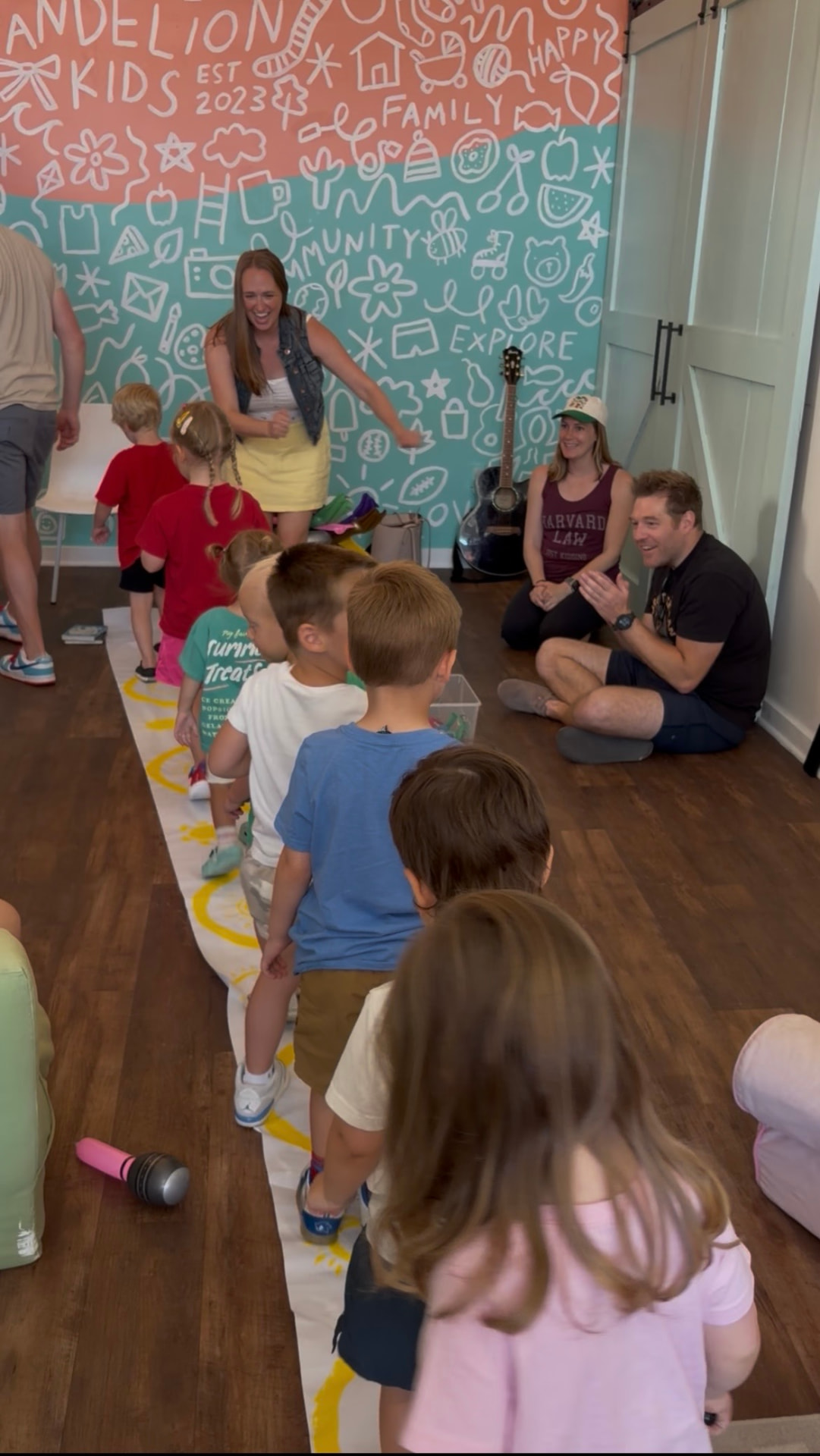 Families and children following a music path together at a Family Jam class